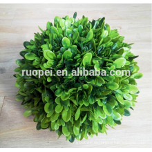 Bola de césped artificial decorativo buxus entregando pared